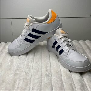 Adidas White and Orange Sneakers with Iconic Stripes